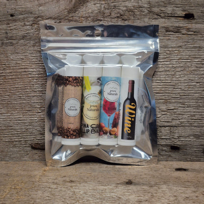 Jaxon Naturals Adult Lip Balm Collection featuring four handcrafted lip balms displayed on rustic barn board.