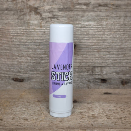 Jaxon Naturals Lavender Jumbo Balm Stick displayed on rustic barn board.