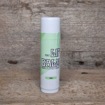 Jaxon Naturals Mint Jumbo Balm Stick displayed on rustic barn board.
