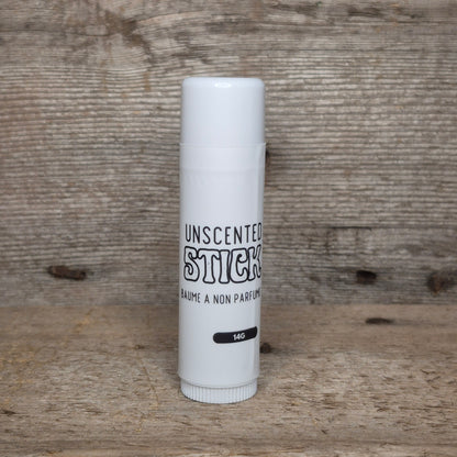 Jaxon Naturals Unscented Jumbo Balm Stick displayed on rustic barn board.