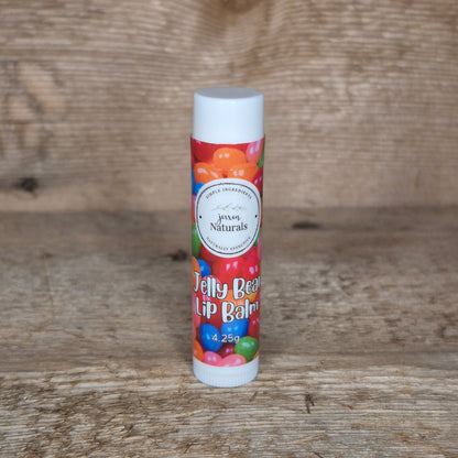 Jaxon Naturals limited edition jelly bean lip balm displayed on rustic barn board.